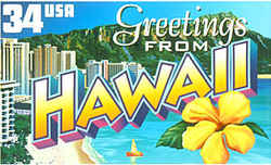 Hawaii Greeting: panoramic view of Waikiki Beach with its hotels lined up behind the strip of sand and the extinct volcano Diamond Head in the distance, and a blossom of yellow hibiscus, the Hawaii state flower, in the foreground