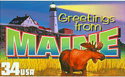 Maine Greeting: A moose, a common animal in Maine, stands in the foreground. At the rear, a lighthouse in Portland sends a beam across the night sky.